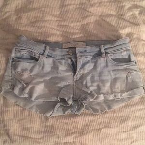 Light denim ripped booty shorts